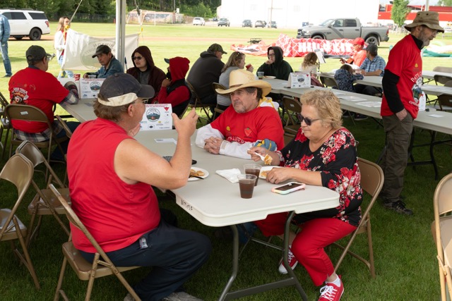 Community members sharing a meal at a Hinton Men's Shed event